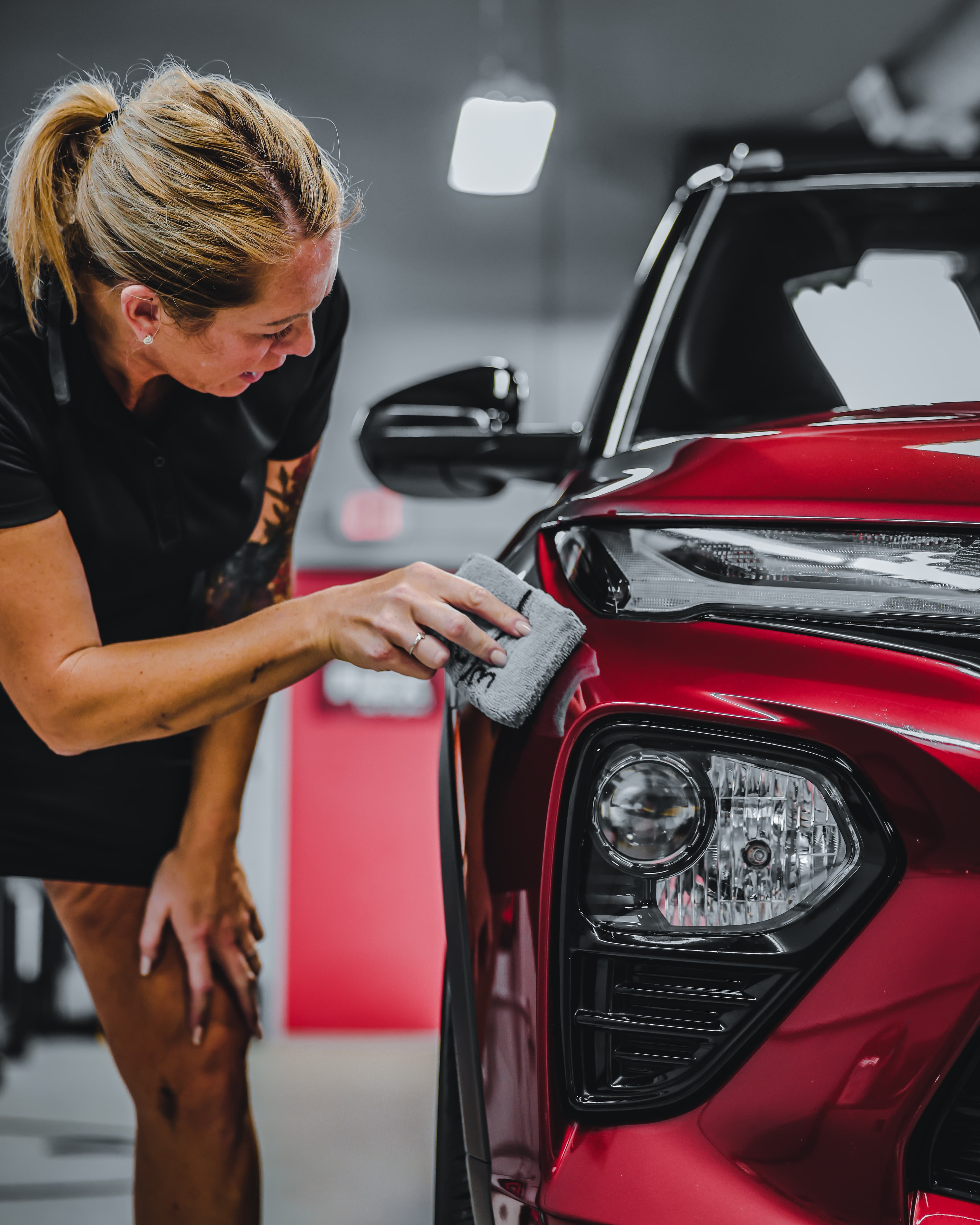 Applying a ceramic coating to a vehicle panel by hand