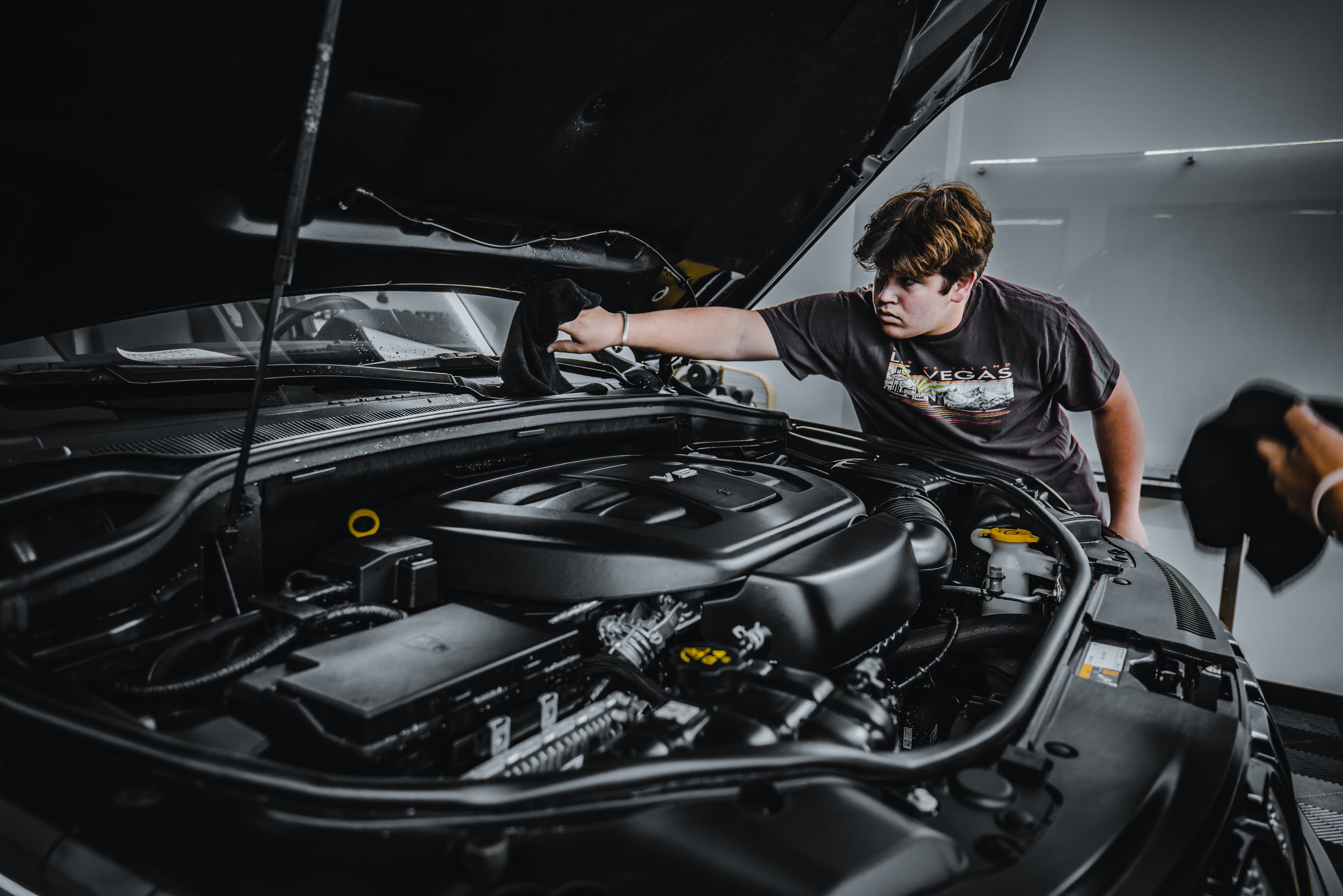 A veteran working hands-on during automotive reconditioning training