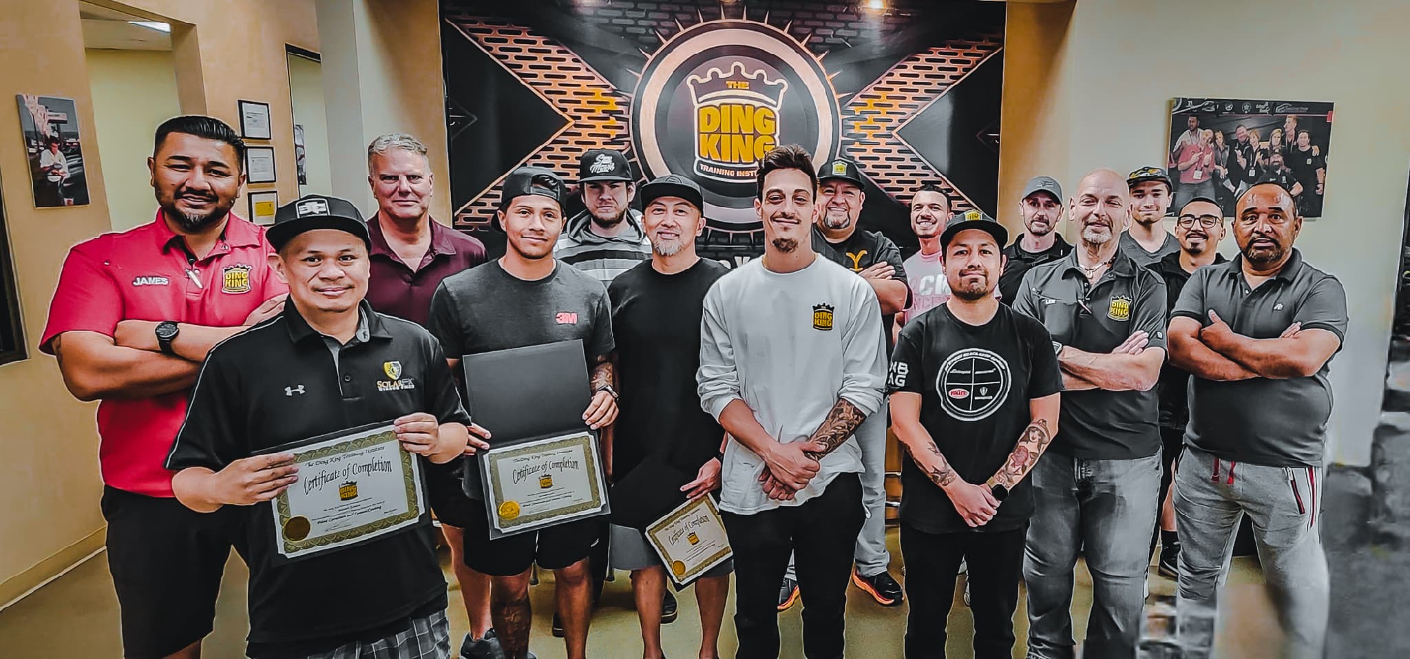 Veterans and instructors together at a Veteran Trade School graduation